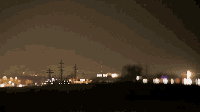 a blurry photo of a city at night