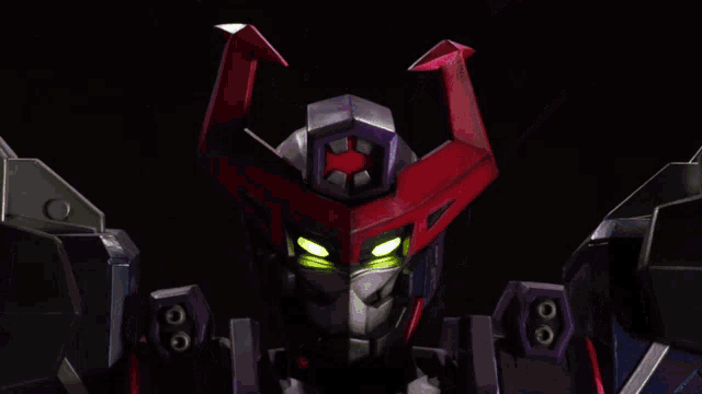 a close up of a robot 's head with a red star on it