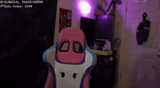 a man wearing a mask and headphones is talking on a twitch stream