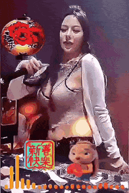 a woman is standing in front of a microphone with a teddy bear in front of her ..