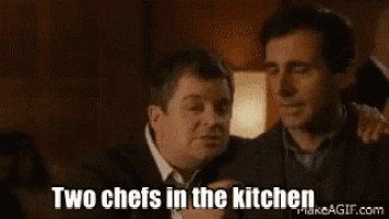 two men are sitting next to each other in a restaurant .