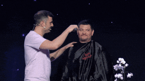 a man is getting his hair cut by a wella barber