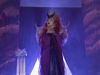 a woman with red hair is wearing a leopard print costume