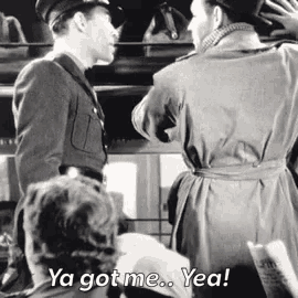 a black and white photo of two men talking with the caption ya got me yea ..