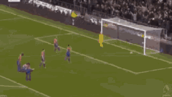 a blurry picture of a soccer player in a white shirt .