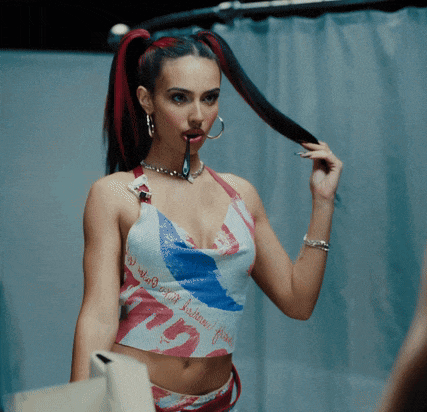 a woman in a crop top that says ' n ' on it