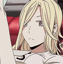 a close up of a blonde anime girl with a number 7 on her shirt .