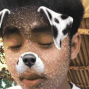 a young man wearing a dalmatian dog mask on his face .