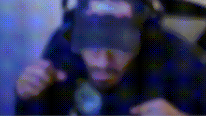a blurry image of a man wearing a virtual reality headset