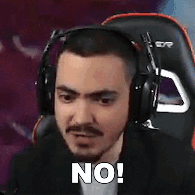 a man wearing headphones is making a funny face and says no .