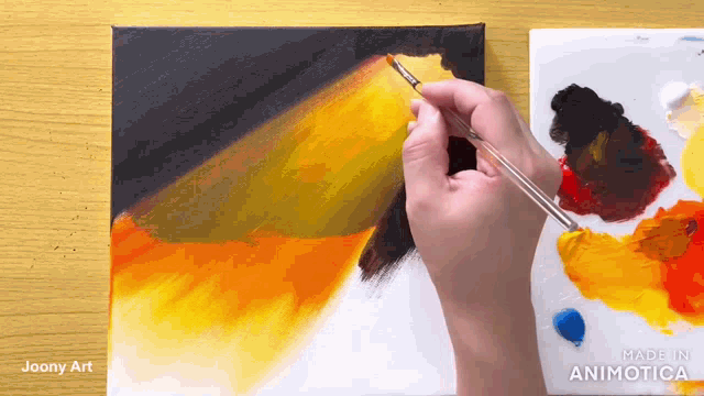 a person is painting on a canvas with a brush and the words made in animatica on the bottom
