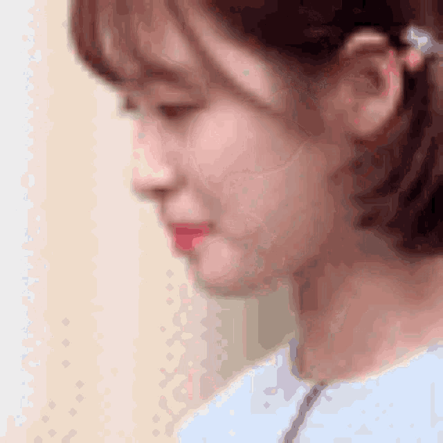 a close up of a woman 's face with her eyes closed