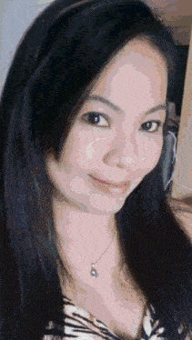 a close up of a woman 's face with a necklace