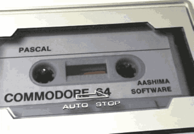 a close up of a cassette tape that says commodore on it