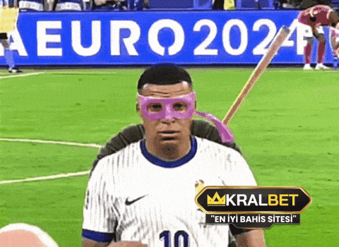 a soccer player wearing a ninja turtle mask stands in front of a euro2024 banner