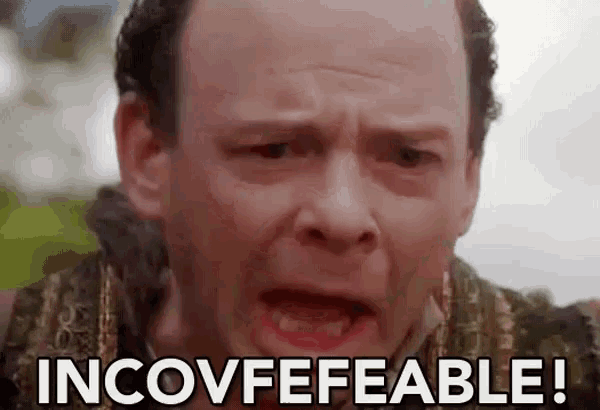 a close up of a man 's face with the words `` incovfefeable '' written on it .