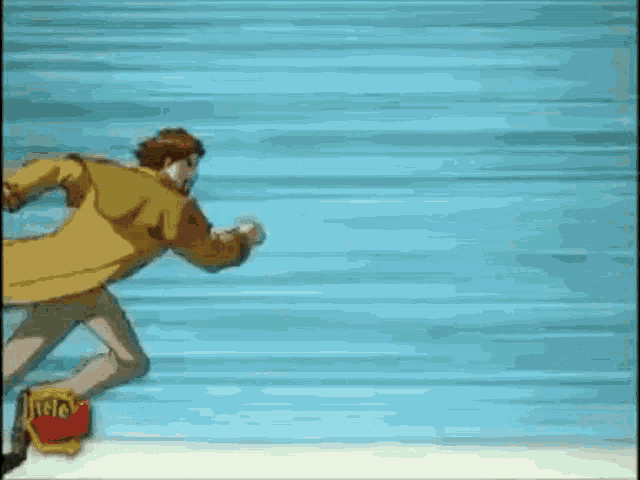 a man in a yellow coat is running with a bag of french fries .