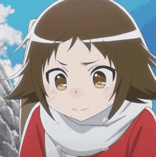 a girl with brown hair and yellow eyes is wearing a scarf