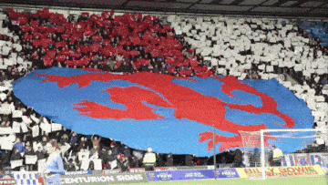 a soccer field with a banner that says centurion signs on it