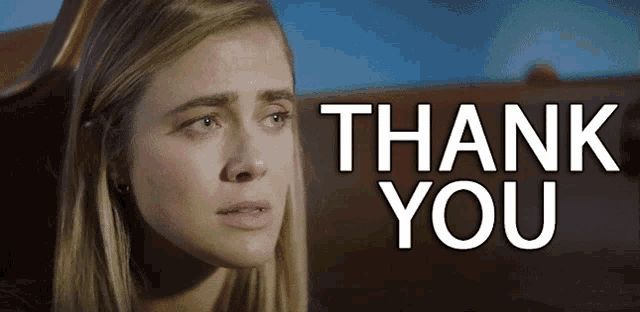 a woman is crying in front of a thank you message