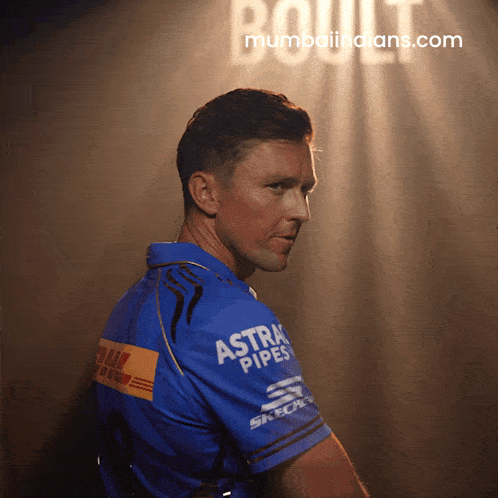 a man wearing a blue shirt with astra pipes on it