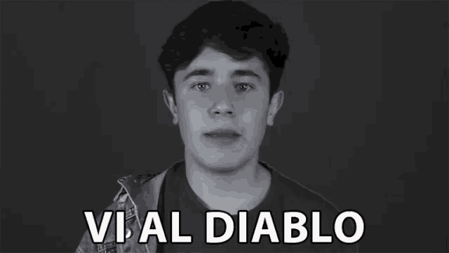 a black and white photo of a young man with the words vi al diablo in white letters