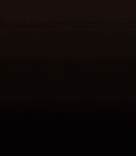 a gold trophy with a star on top is glowing in the dark