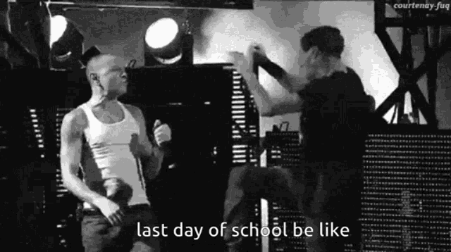 a black and white photo of two men with the words last day of school be like below them