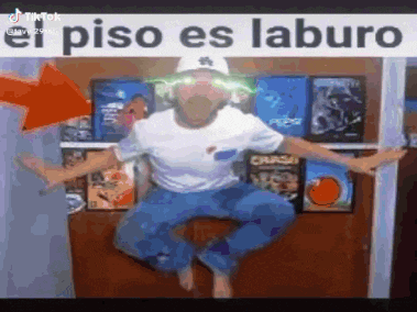 a man is jumping in the air with a sign that says el piso es laburo .