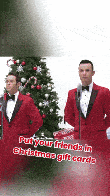 two men in red tuxedos stand in front of microphones with the words put your friends in christmas gift cards below them