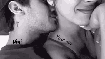 a man is kissing a woman on the neck . the woman has a tattoo on her neck .
