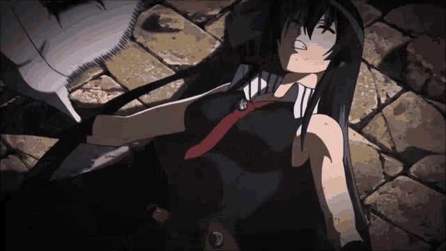 a woman with long black hair is laying on the ground