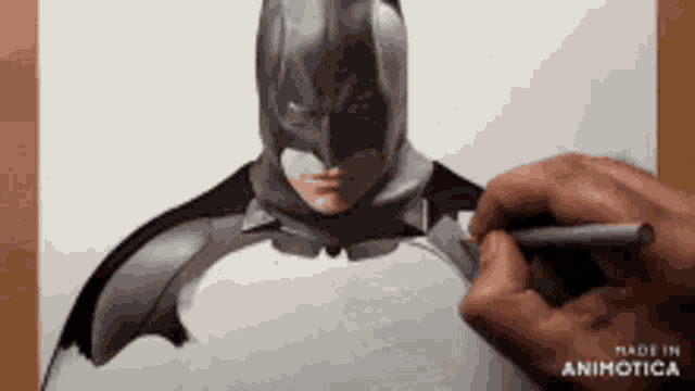 a person is drawing a batman on a piece of paper made in animotica