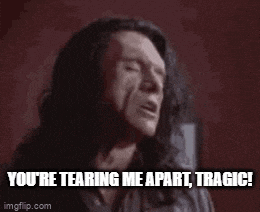 a man is screaming with the words " you 're tearing me apart tragic "