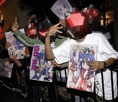 a man wearing a robot head holds up a poster that says lucky star