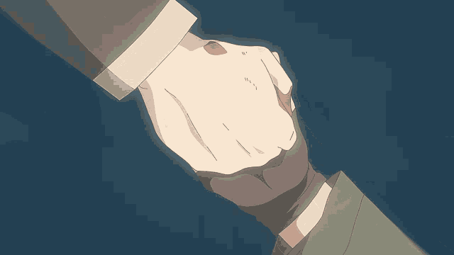 a person holding another person 's hand with a glove on
