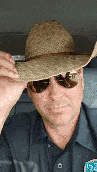 a man wearing a straw hat and sunglasses is wearing a shirt that says peter
