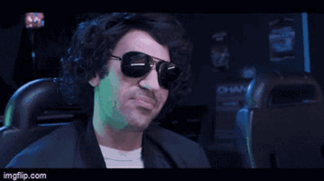 a man wearing sunglasses and headphones says i think i can handle a few laps around the block ..
