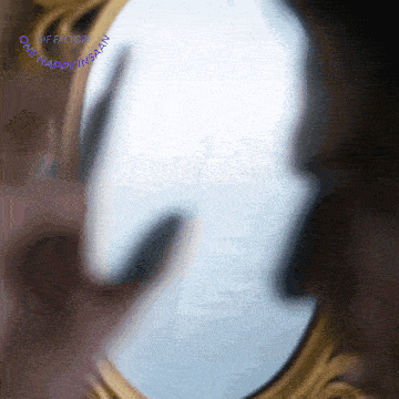 a close up of a mirror with a gif factory logo