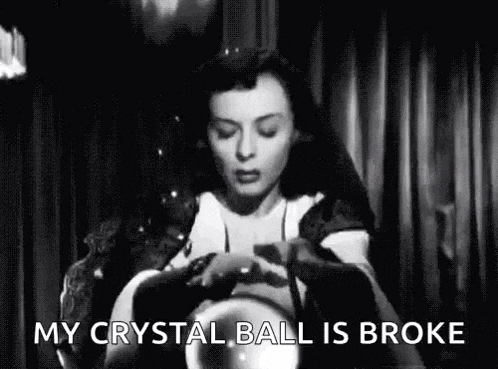 a woman is holding a crystal ball and saying `` my crystal ball is broke '' in a black and white photo .