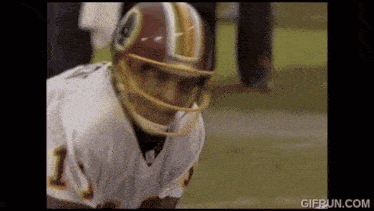 a football player wearing a redskins helmet and number 1 jersey