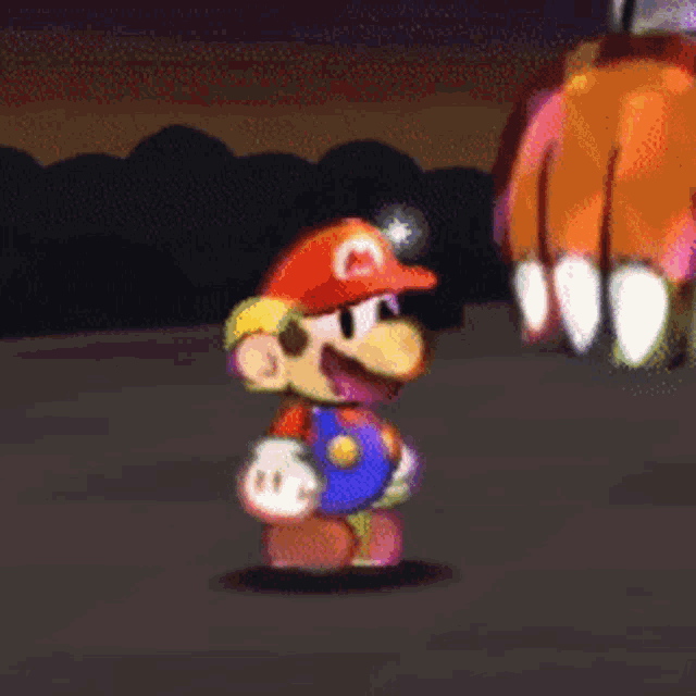 a cartoon of mario wearing a red hat with a m on it