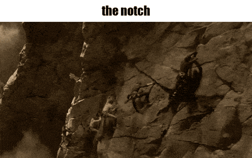 a picture of a person climbing a rock wall with the caption " the notch "