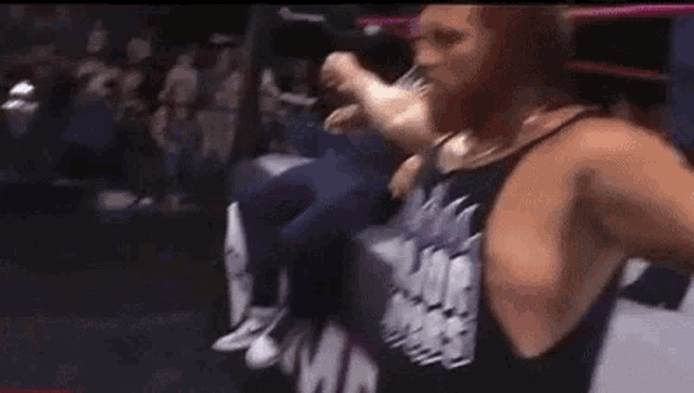 a man wearing a tank top that says major sports