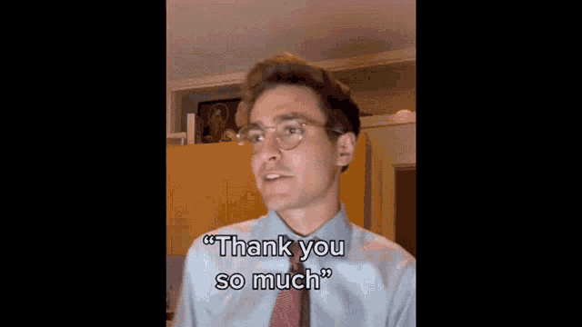 a man wearing glasses and a tie says thank you so much