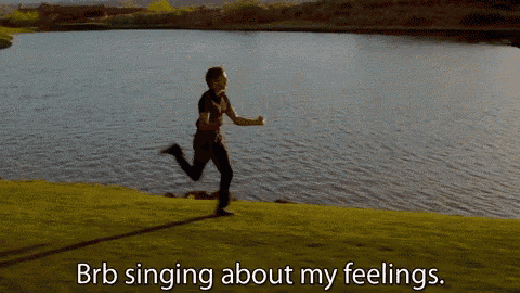 a man is running by a lake with the words brb singing about my feelings