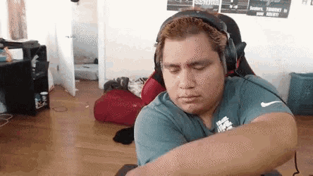 a man wearing headphones and a shirt that says nike