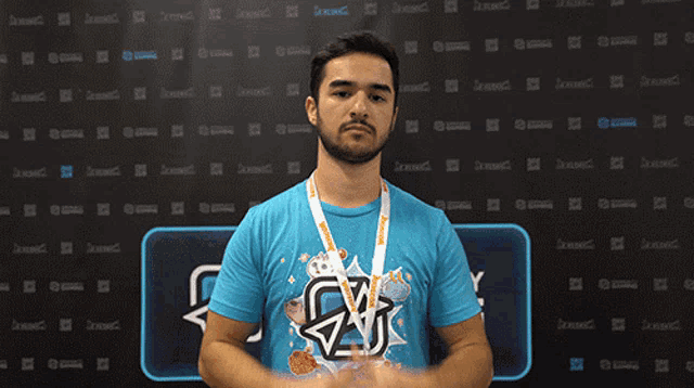 a man wearing a blue shirt that says cw