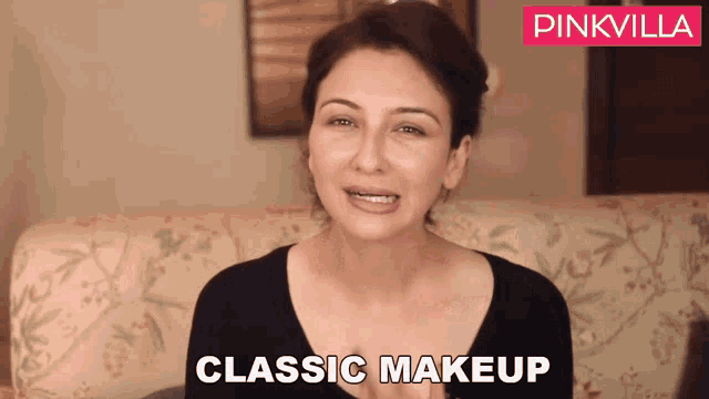 a woman sitting on a couch with the words classic makeup on the bottom