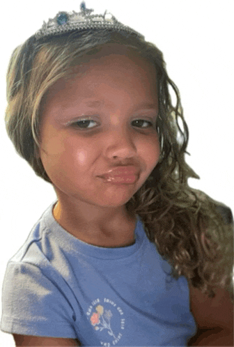 a little girl wearing a tiara and a t-shirt that says " be brave "